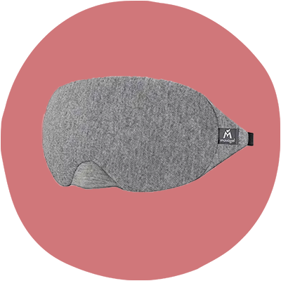 a grey eye mask on a pink background